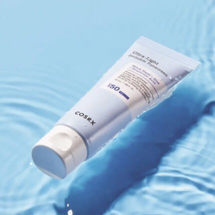 COSRX Ultra-Light Invisible Sunscreen tube displaying clear weightless daily UV protection formula